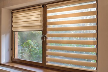 Window roller, duo system day and night. Cozy home interior.