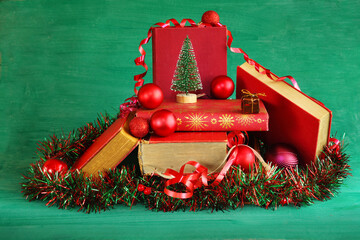 books as christmas gift,christmas present,reading,literature,education, christmas,holiday concept with stack of books, christmas tree and decoration