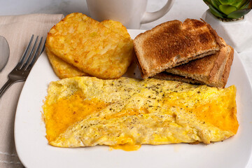 cheese omelette with  hash browns,