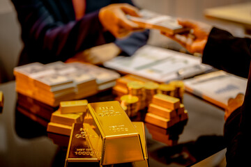 A suited Asian analyst confirms the tangible value of global gold holdings, carefully placing a...