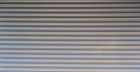 Background of corrugated metal sheet,white Slide door ,roller shutter texture, grills and metal doors security