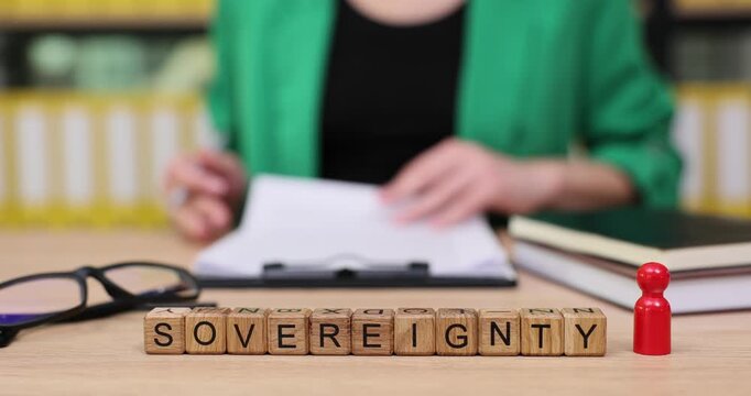 Exploring the meaning of sovereignty through creative wordplay and focused writing in a cozy workspace