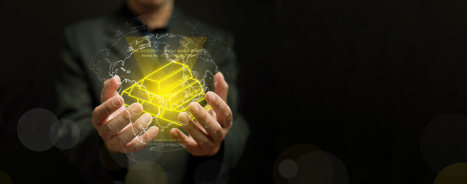 Businessman holding glowing digital gold bars surrounded by world map network. Concept of global finance, wealth reserve, fintech innovation, and value security in modern investment.