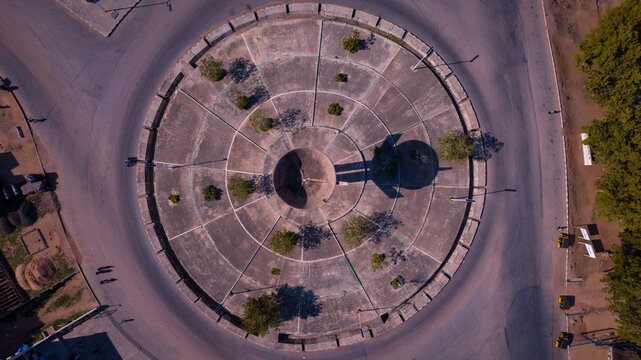 Aerial view of the Jippu Jam Roundabout, a circular concrete island with a central monument and radial tree plantings, Yola, Adamawa State, Nigeria.