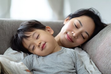 Child Deep Breath. Asian Mother and Son Happiness on Sofa Breathing Fresh Air