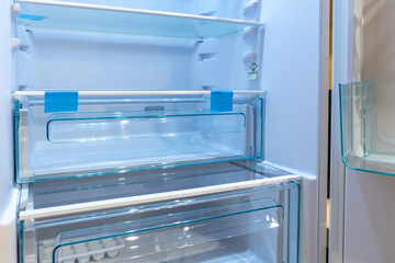Empty Refrigerator with Blue Light – Clean Modern Kitchen Appliance