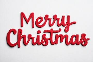 Embroidered red Merry Christmas text in cozy festive design on fabric texture.