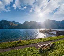 Peaceful autumn Alps mountain lake. Morning view to Traunsee lake and Traunstein mountain in far, Upper Austria.