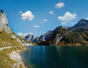 Fototapeta premium Sunny autumn alpine Tappenkarsee lake and rocky mountains above, Kleinarl, Land Salzburg, Austria.