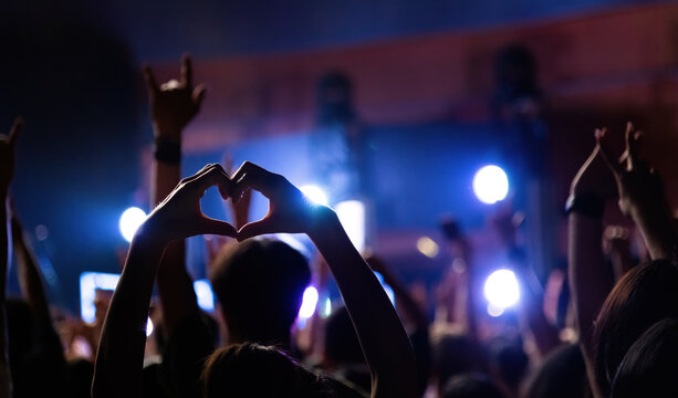 Heart shaped hands at the concert
