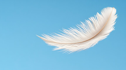 Obraz premium White feather floating in blue sky symbolizes purity and lightness, evoking serenity