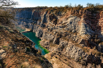 Scenic canyon landscape with turquoise river and rocky cliffs in sunlit valley