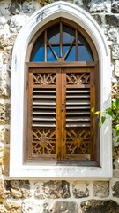 Obraz premium Ornate wooden doors in a stone archway