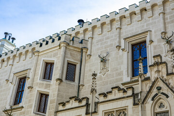 Obraz premium Gothic revival architecture of historic castle with medieval elements and ornate windows