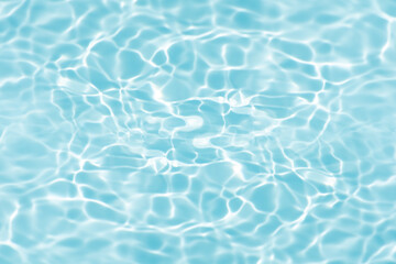 Blue water with ripples on the surface. Defocus blurred transparent blue colored clear calm water...