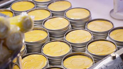 Korean dalgona candy with various pressed shapes, a popular street food and traditional sweet