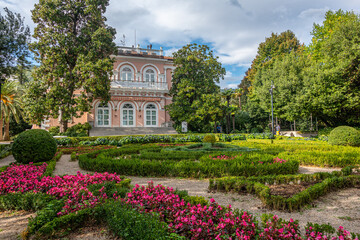 Obraz premium Beautiful park with tree species and patterned flowerbed in Opatija