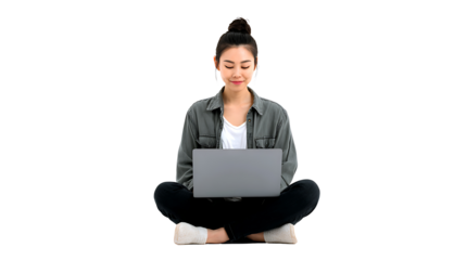 Asian girl sitting cross-legged using laptop, isolated on a white background