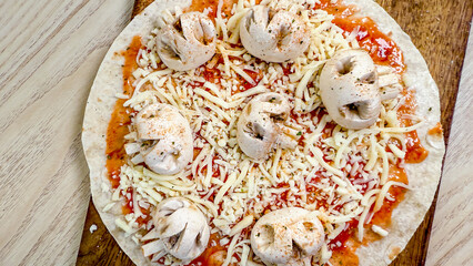 Rustic dough globes nestle amidst cheese strings and vibrant sauce, evoking empanada festivity and...