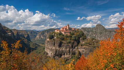Naklejka premium Stunning fall scenery featuring ancient monasteries perched atop towering rock formations