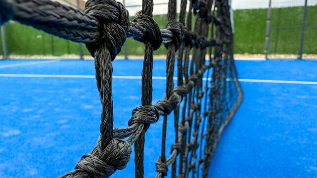 Entwined ropes on vivid blue paddle court evoke precision and sport zest, ideal for World Paddle Day celebration