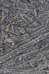 The texture of ice and frost on the surface of a plywood board
