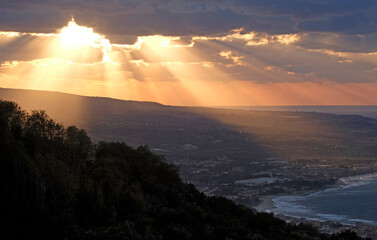 Dramatic sky and colors during a sunset at the coast of Italy near Pizzo in Calabria