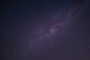 Fototapeta premium Starry night with the Milky Way stretching across the sky