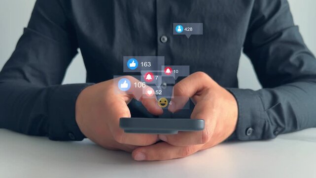 Interactive with friends on chat with emoticon feedback.Social media,marketing, like,social network,blog,live,chat reaction and livestream.Person using smart phone with emoticon icons of Social Media.