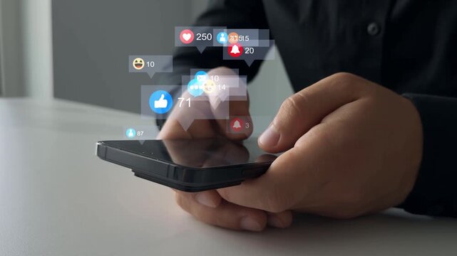 Interactive with friends on chat with emoticon feedback.Social media,marketing, like,social network,blog,live,chat reaction and livestream.Person using smart phone with emoticon icons of Social Media.