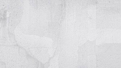 Close-up of a rugged white cement surface with minimalistic shadowed textures