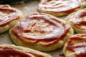 Homemade mini pizzas with sausages. Pastries. Bread. Dough.