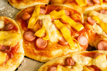 Homemade mini pizzas with sausages. Pastries. Bread. Dough.
