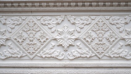 Obraz premium Decorative bas-relief featuring geometric and Rococo stucco details on a white surface