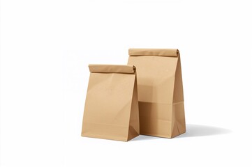 Fototapeta premium Pair of brown paper bags set against a white backdrop