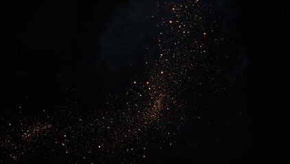 Obraz premium Glowing embers floating against a dark backdrop. Barbecue ashes scattered on a black surface. Sparkling fiery particles on a pitch-black background.