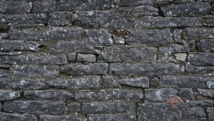 Obraz premium Texture of an ancient stone wall