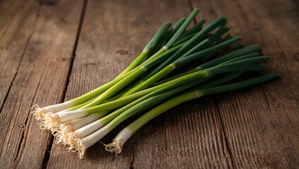 Freshly picked green onions from the backyard on a rustic wooden surface