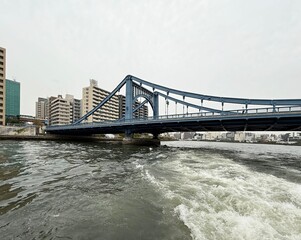 Rainbow Bridge in Tokyo, Japan. It is a suspension bridge that spans the Tokyo 