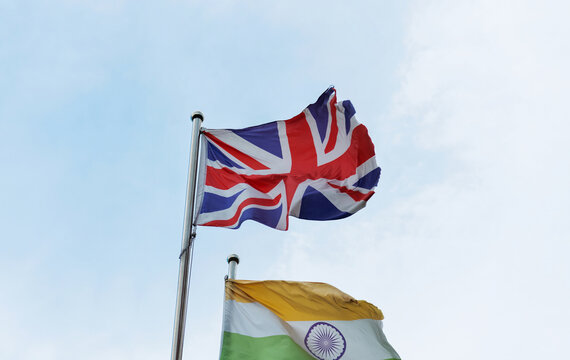 British and Indian flags in the sky
