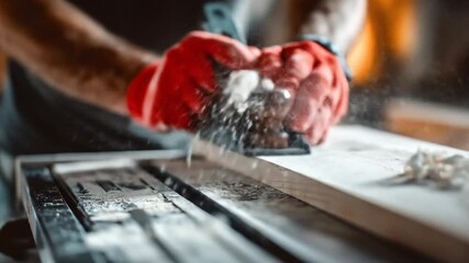 A skilled carpenter using a hand planer to smooth a wooden plank in a workshop, with sawdust flying and tools visible in the background, showcasing craftsmanship and woodworking techniques
