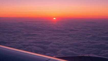 Sunset at night seen from an aircraft above the clouds