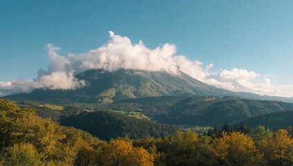 Clouds Hovering Over a Mountain Amidst a Lush Forest