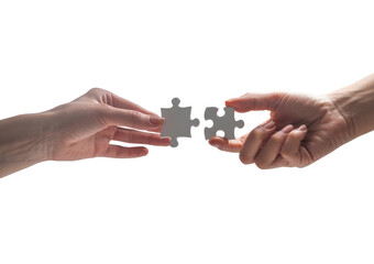 Hands connecting two white jigsaw puzzle pieces for a teamwork solution isolated on transparent white background 