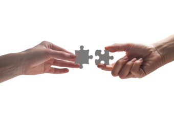 Hands connecting two white jigsaw puzzle pieces for a teamwork solution isolated on transparent white background 