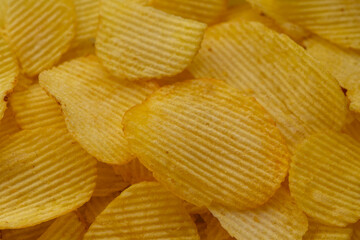 Potato chips spread in a plate close-up
