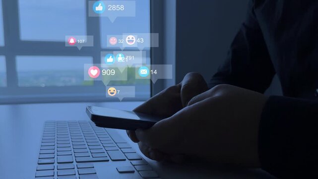 Interactive with friends on chat with emoticon feedback.Social media,marketing, like,social network,blog,live,chat reaction and livestream.Person using smart phone with emoticon icons of Social Media.