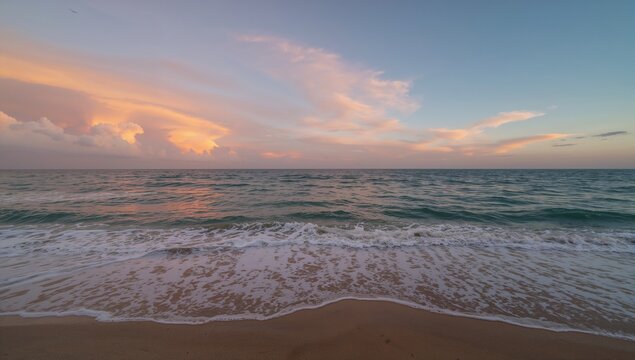 Fototapeta Dawn breaking above the ocean with breathtaking cloud formations
