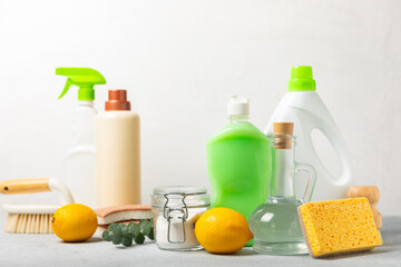 Eco cleaning.Cleaning products on a textured background. Eco-friendly home cleaning. A bottle of natural detergent surfaces, eco brushes, sponges, and rags. Cleaner concept.Cleaning supplies.Flat lay.