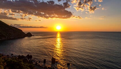 Scenic sunrise over tranquil ocean